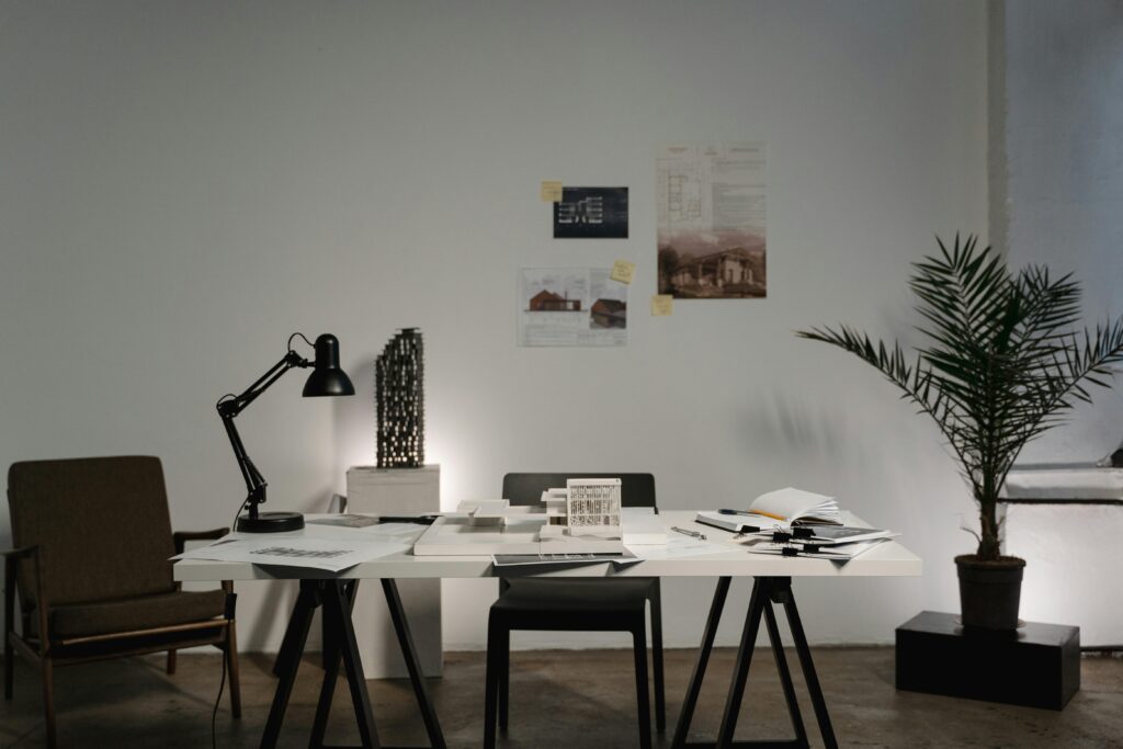 Minimalist architecture office with modern decor, white desk, and stylish layout.
