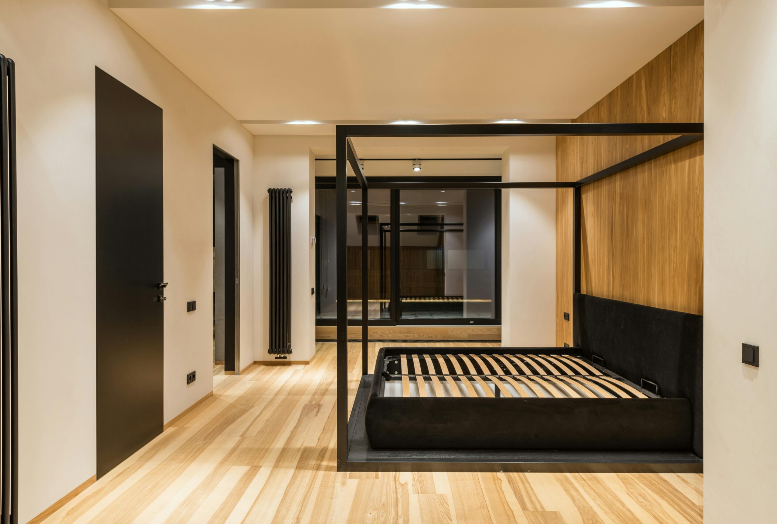 Sleek contemporary bedroom with wooden floor and stylish design. Ideal interior inspiration.